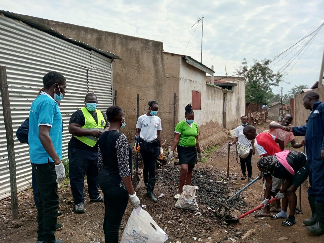 A team of volunteers cleaning up a community area.